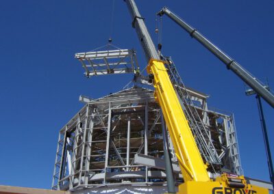 a crane lifting a metal structure