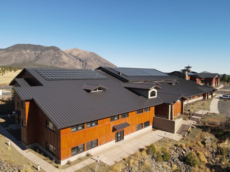 a building with solar panels on the roof